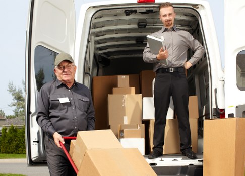 Movers handling same day removals in Canary Wharf near modern office towers