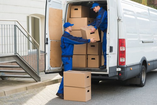 Efficient house removal service in Canary Wharf with packed boxes and moving van