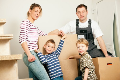 Movers preparing boxes and furniture for a Canary Wharf apartment move