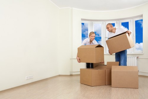 Professional piano movers handling an upright piano with care