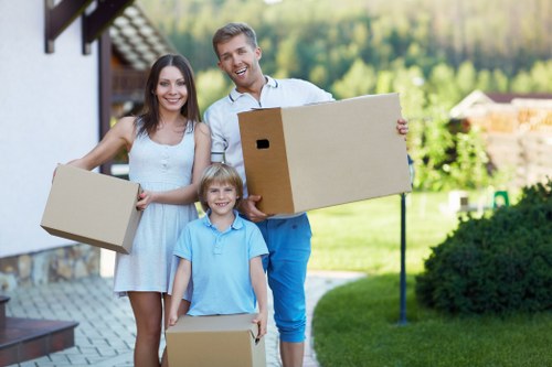 Professional movers handling packed boxes during a Canary Wharf move