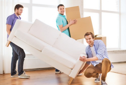 Professional house removals team planning a move in a Canary Wharf apartment block
