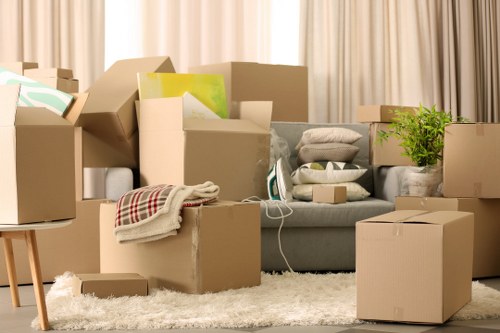 Packing boxes and labeling items for a Canary Wharf house move