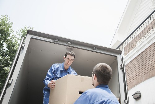 Careful furniture transport by Canary Wharf Movers in a city setting