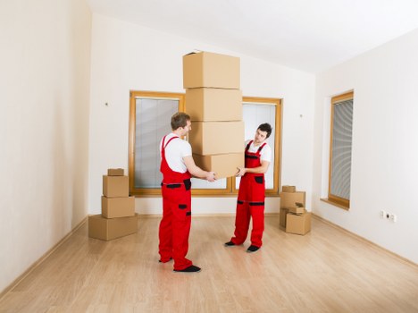 Canary Wharf movers reviewing a safety checklist before starting work